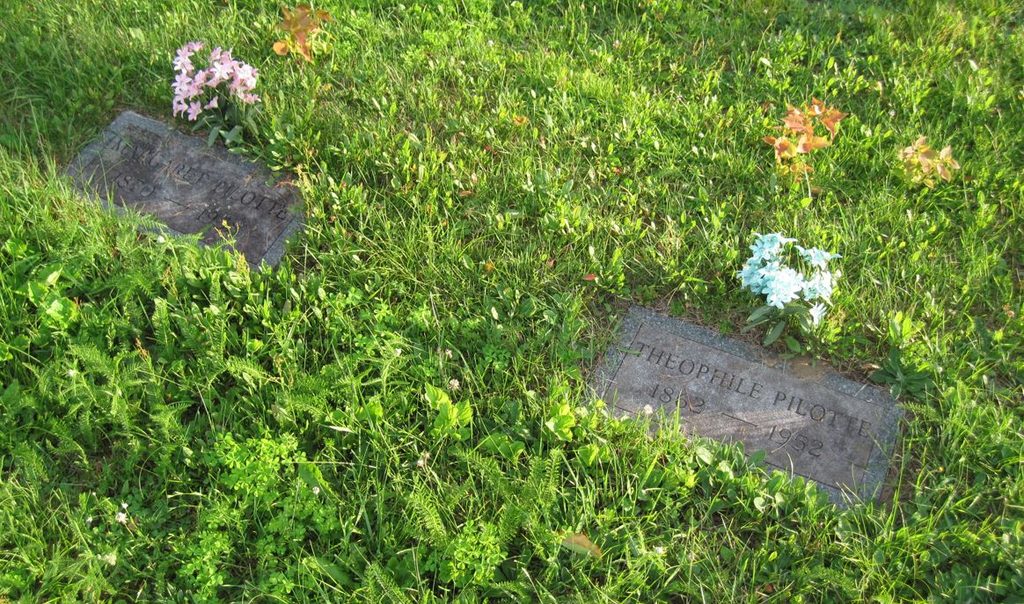 Two flat grave stones: "Margaret Pilotte 1870-1958" and "Theophile Pilotte 1862-1952"